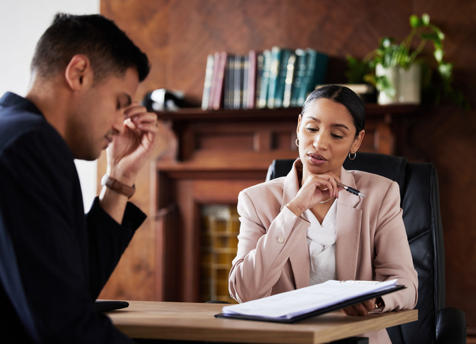 lawyer presenting legal document while having a discussion with client - what happens if I lose my personal injury claim?